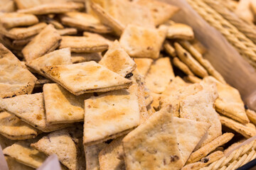 crispy cookies in wicker baskets on the counter