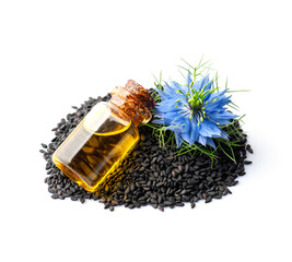 Oil of black cumin seed and nigella sativa flower on white backgrounds.