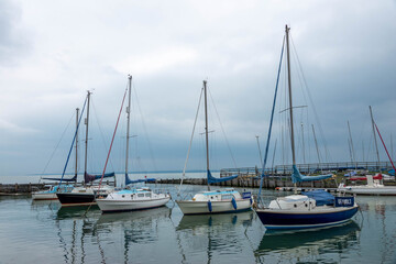 Fototapeta na wymiar boats moored in the marina on a stormy summer day