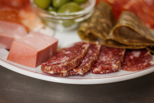 Italian cold cuts, charcuterie, salami, mortadella and ciccioli