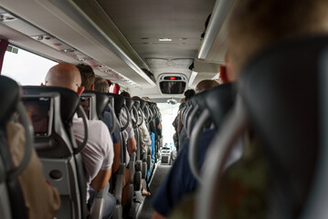 A lot of people inside bus. Tourists