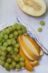 Still life with melon and a glass of water