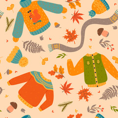 Autumn seamless pattern with clothes and leaves. Vector graphics.