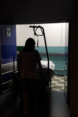 Nurse carrying a bed in the hospital