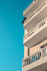 Beautiful balconies in a classic style flooded with sunlight.