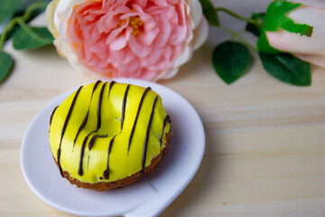 yellow donut on a wooden background