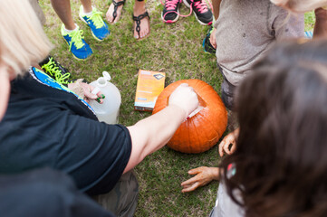Teacher doing science experiment outside with kids