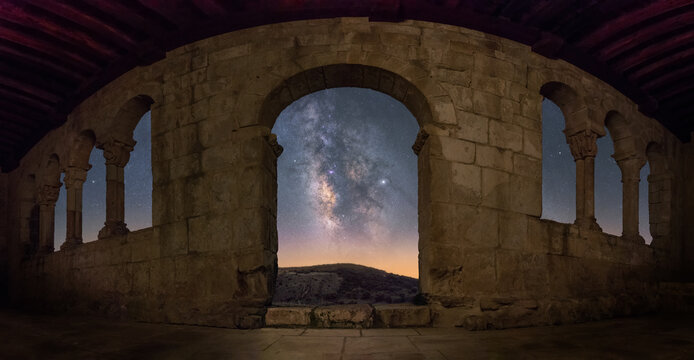 Ancient stone ruins under starry sky with Milky Way
