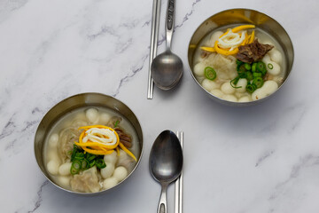 Korean style rice cake soup which is called Jolaeng-i Ddukkuk eats on the Lunar moon new year