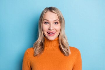 Photo of young happy positive blonde woman smile amazed good mood isolated on pastel blue color...