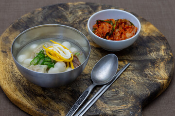 Korean style rice cake soup which is called Jolaeng-i Ddukkuk eats on the Lunar moon new year