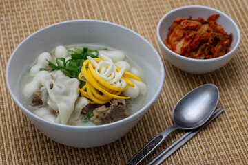 Korean style rice cake soup which is called Jolaeng-i Ddukkuk eats on the Lunar moon new year