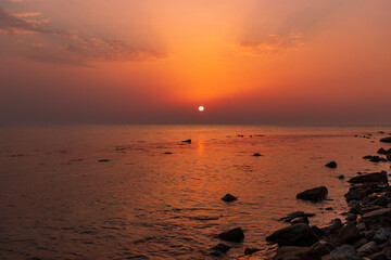 Sunset over the sea horizon