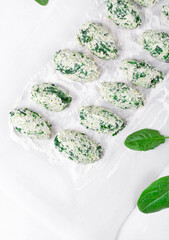 Cooking Gnudi with ricotta and spinach. Italian meal