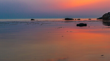 Sunset over the sea horizon