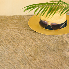 summer beach hat with sun glasses.sandy idea aesthetic tropic sea concept with green palm branch