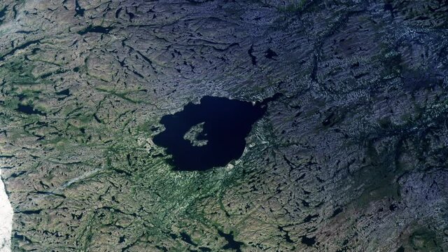 Lake and rocks, night to day sunrise animation aerial satellite view of Mistastin lake in Canada, result of asteroid impact. Images furnished by Nasa
