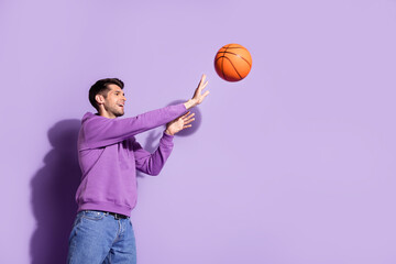 Photo portrait man playing basketball in hoody isolated pastel violet color background