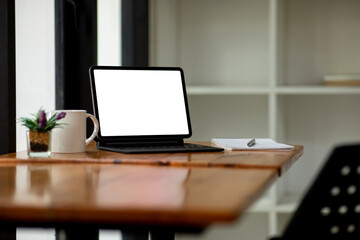 Workplace concept, Mockup blank screen tablet with blank white screen in office modern.
