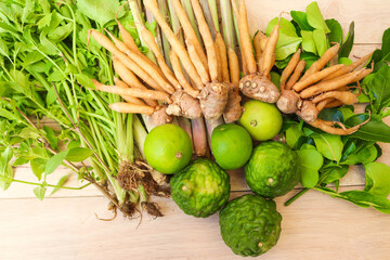 Many vegetables green fresh for herbs isolated on wooden background closeup.