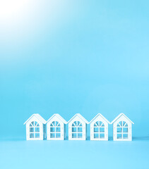 Small white houses. Cottage village by the sea. Ecology and real estate concept. Houses in the resort town.