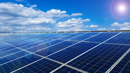 Solar cell panels installed on the roof top of a house become dirty caused by birds poops, with white clouds ,blue sky and the sunlight, to provide power to the house, to go green energy concept