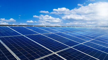 Solar cell panels installed on the roof top of a house become dirty caused by birds poops, with white clouds ,blue sky and the sunlight, to provide power to the house, to go green energy concept