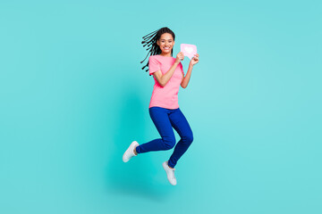 Fototapeta na wymiar Photo of crazy funky girl jump hold like button card wear pink t-shirt isolated on blue color background