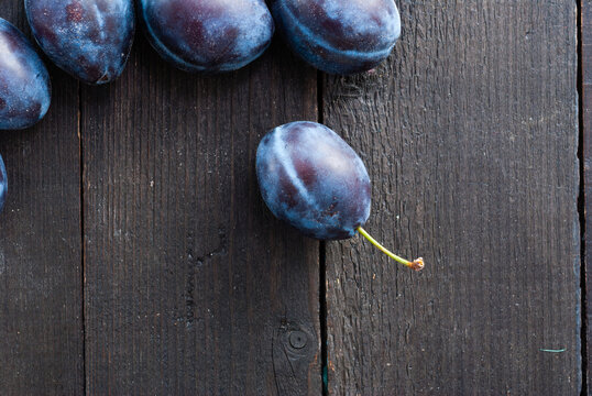 Plums On Dark Wood Table Directly Above