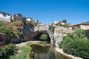 Fototapeta na wymiar Beautiful view of Puentedey, a picturesque village with a natural bridge over the river. Merindades, Burgos, Spain, Europe