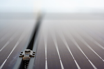 Side support bracked between solar panels on a new installation on a residential roof