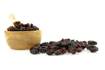 Black sweet Raisins or dried sweet grapes (kali kishmish or Zante currant) isolated on white background