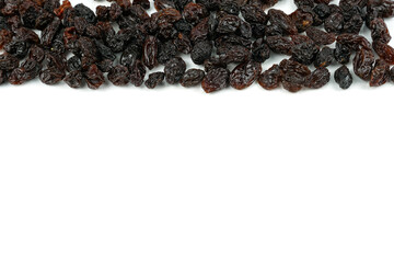 Black sweet Raisins or dried sweet grapes (kali kishmish or Zante currant) isolated on white background