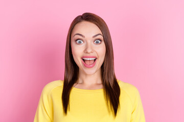 Portrait of attractive amazed cheerful girl great news good reaction isolated over pastel pink color background