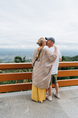 Tourist couple standing at viewpoint at Doi Suthep