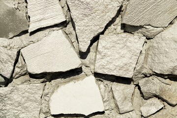 Texture of decorative masonry with natural stone painted with silver color 