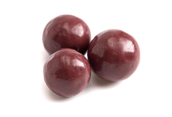 Dark Red Coated Chocolate Covered Dried Fruit on a White Background