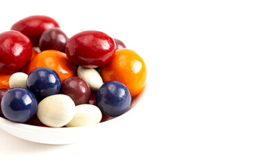 A Mix of Candy Coated Chocolate Covered Dried Fruit Isolated on a White Background