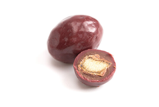 Dark Red Coated Chocolate Covered Dried Fruit on a White Background