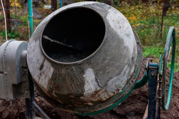 Mixing of concrete in the concrete mixer at construction site