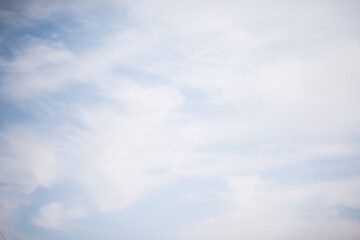 Scattered cloud clusters in a blue sky, blue sky background with white clouds,