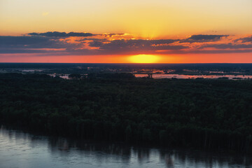 Aerial drone view of river landscape in sunny summer evening