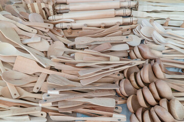 handmade wooden spoons and kitchen utensils as a background