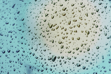Abstract Water droplets gathered on the windshield. 