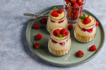 Homemade raspberry trifles on a light background.