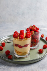 Homemade raspberry trifles on a light background.