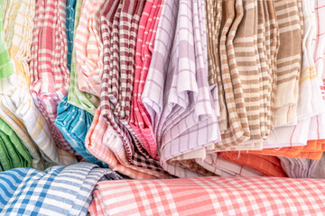 background with colorful folded cotton clothes