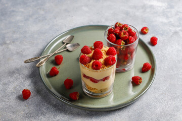 Homemade raspberry trifles on a light background.