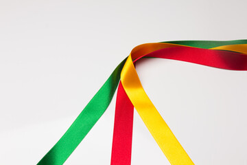 Coloured fabrics and ribbons; basic colours on a white background