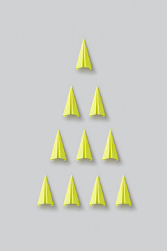 Yellow paperplanes in triangle shape